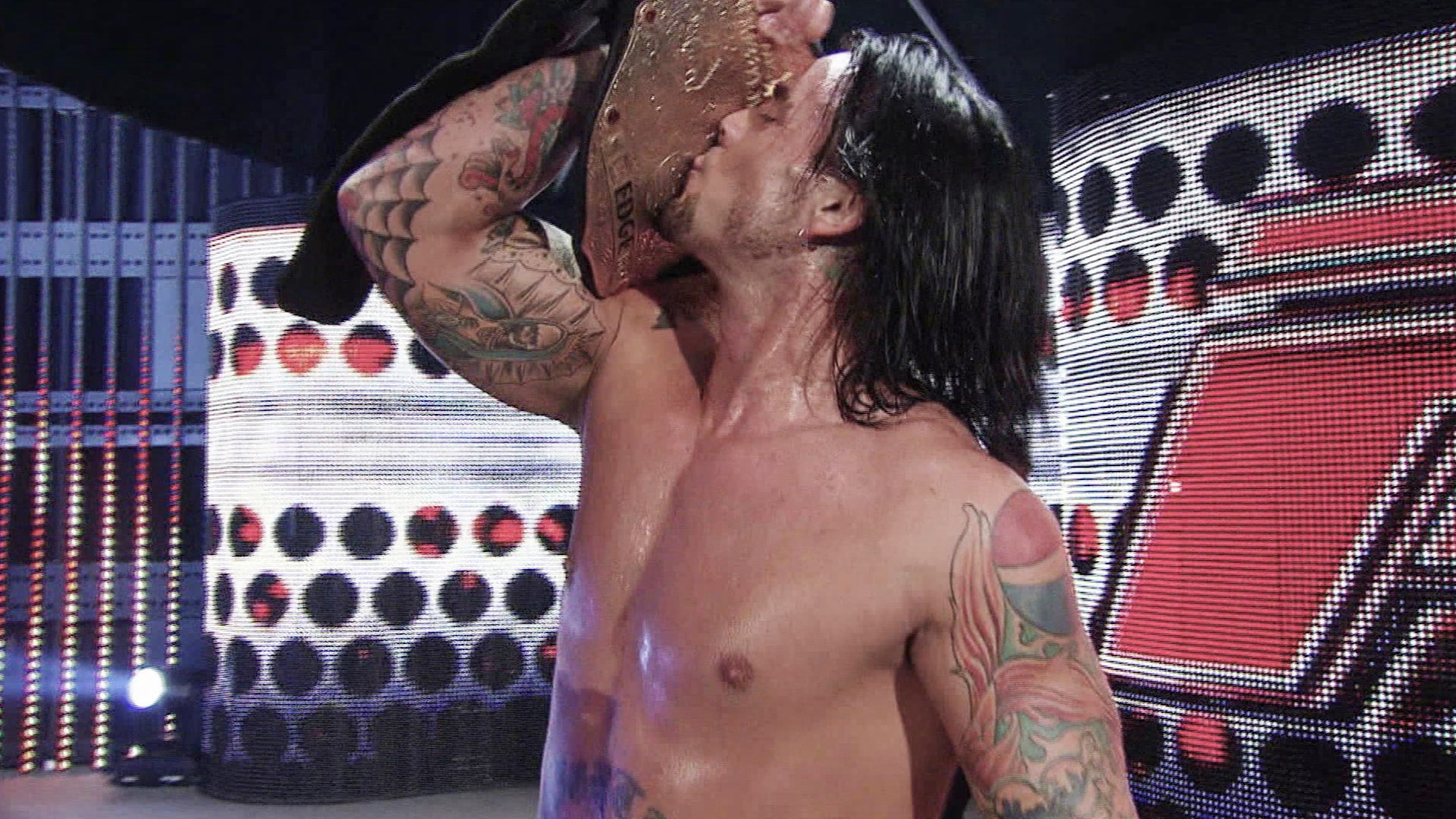 CM Punk kisses his belt