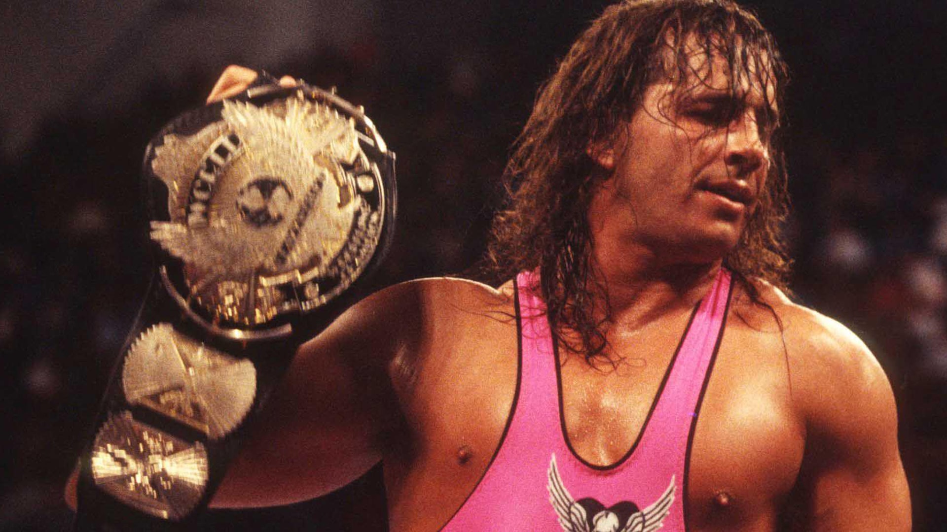 Bret Hart holding a belt