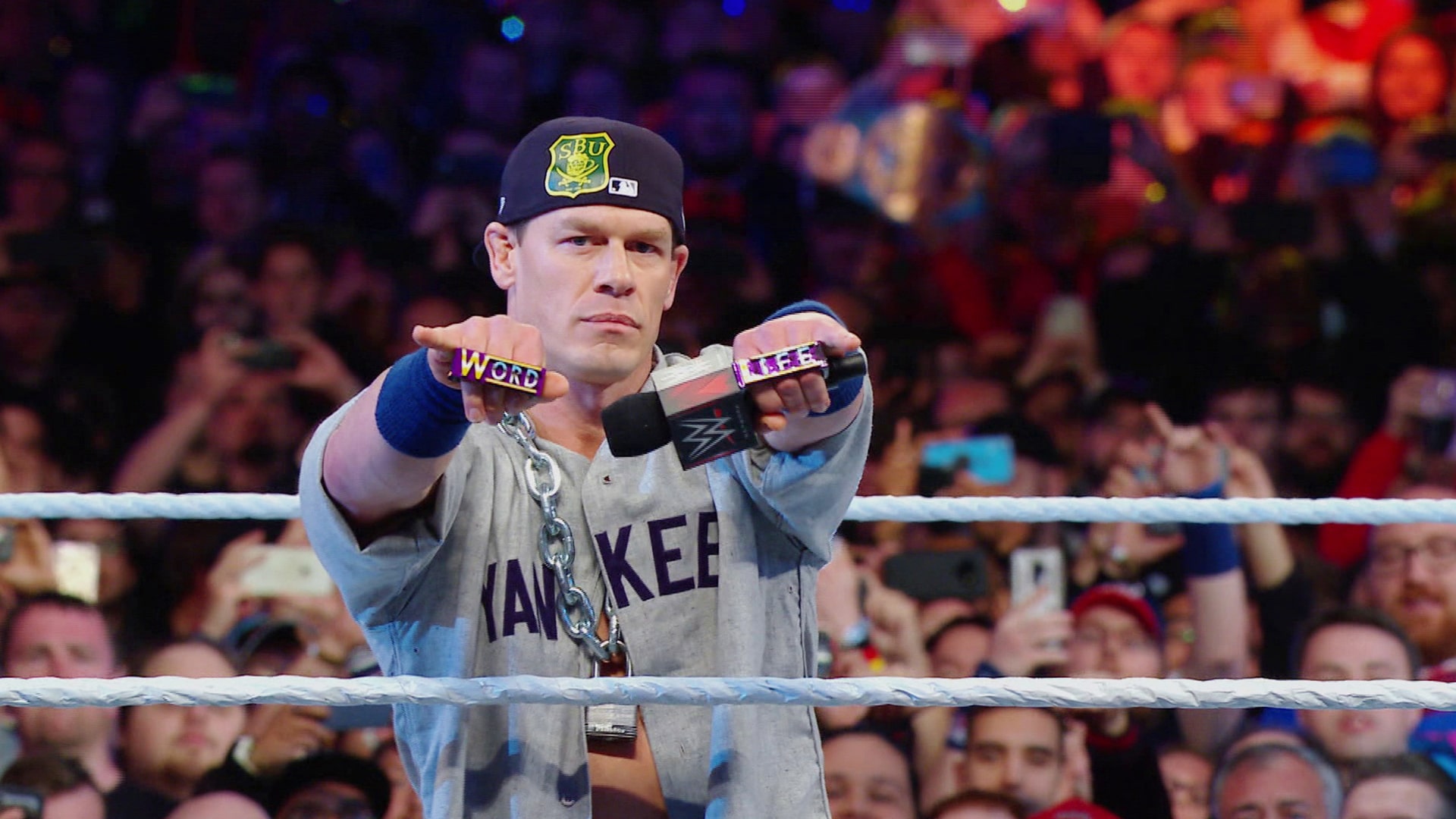 John Cena in the ring pointing his fists at the camera