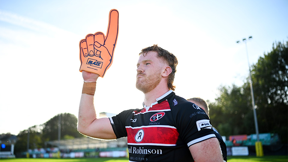 A Cornish Pirates rugby player wearing a BLAZE-branded foam finger