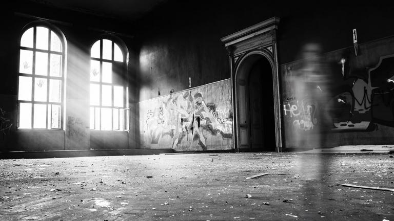 A ghostly black and white photo of an old school