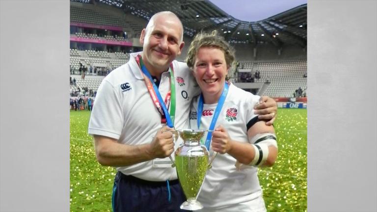 Rocky Clark and head coach Graham Smith with the 2014 Women's Rugby World Cup trophy