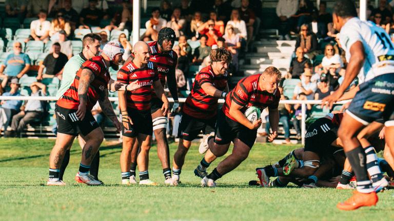 A Blackheath player runs with the ball against Doncaster Knights